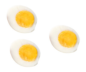 Top view set of unpeeled cooked or boiled chicken eggs in three halves with egg yolks isolated with clipping path in png file format