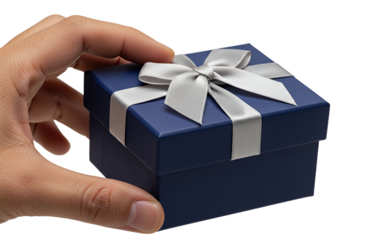 Hand holding a blue gift box with a silver ribbon isolated on transparent background, representing celebration, surprise, and special occasions