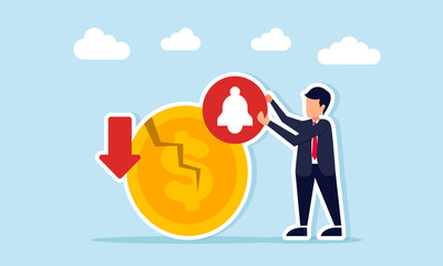 businessman holding notification sign near cracked coin with downward arrow illustration of awareness in facing business crisis or loss