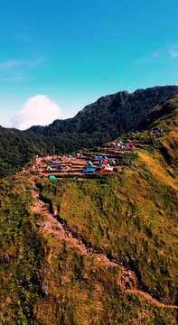 Stunning aerial footage shows a camping area on the ridge of Mount Ungaran with brightly colored tents under a clear blue sky in Semarang, Central Java on September 16, 2024.