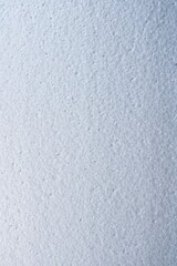 Close up texture of white styrofoam surface with soft lighting