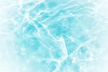 Obraz premium Blue water with ripples on the surface. Defocus blurred transparent blue colored clear calm water surface texture with splashes and bubbles. Water waves with shining pattern texture background.