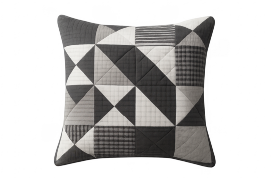 Quilted patchwork cushion featuring geometric monochrome pattern