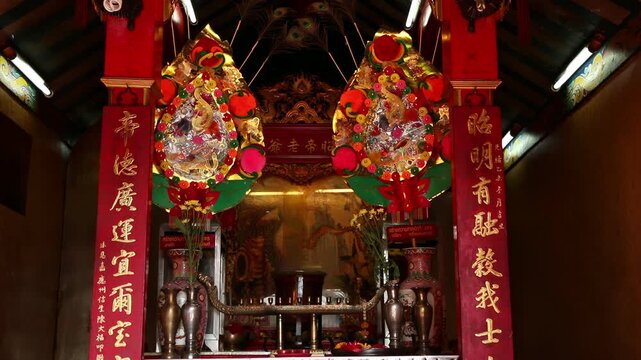 Ornate Red Chinese Shrine Interior with Altar, Temple of Chinese God in chanthaburi, Thailand.