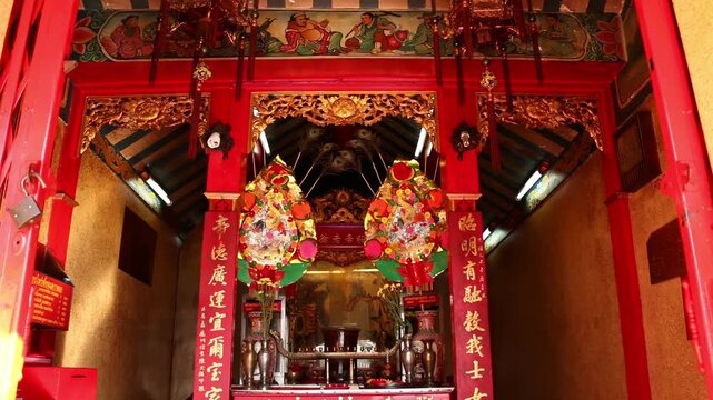 Ornate Red Chinese Shrine Interior with Altar, Temple of Chinese God in chanthaburi, Thailand.