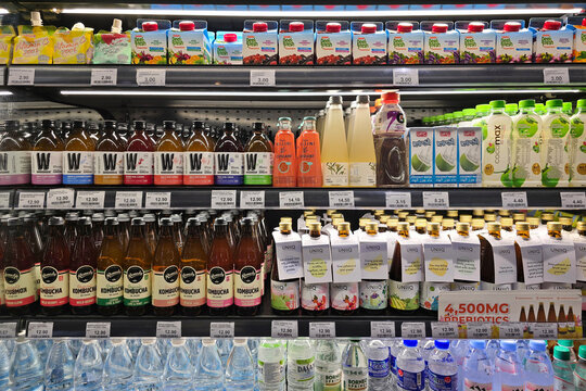 Penang, Malaysia &ndash; Sep 26, 2025: A variety of kombucha and health drinks arranged neatly on refrigerated shelves inside Mercato grocery store.