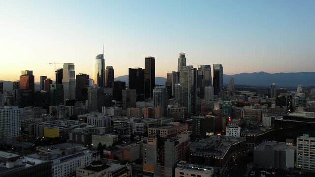 Downtown Los Angeles at sunset, aerial rising over the city of LA skyscrapers 