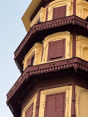 Rajwada Palace Indore—historic royal landmark, ornate Maratha architecture, carved wooden balconies and arched windows, iconic heritage building in Madhya Pradesh, India.