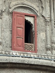 Rajwada Palace Indore—historic royal landmark, ornate Maratha architecture, carved wooden balconies and arched windows, iconic heritage building in Madhya Pradesh, India.