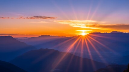 Majestic Mountain Sunrise – Radiant Sky Over Misty Valleys and Silhouetted Peaks