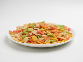 Raw crackers, piled on white background