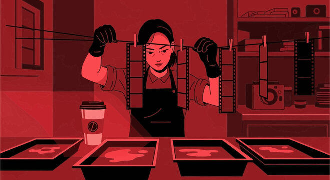 Artistic exploration of a photographer at work in a darkroom illuminated by red tones