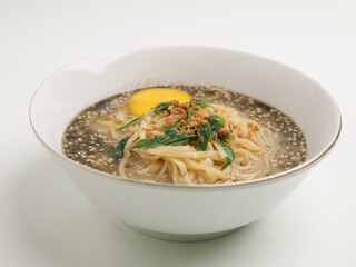 Noodle cooked in meat broth served with raw egg