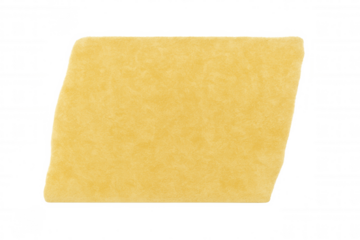 Uncooked lasagna pasta sheet with an irregular parallelogram shape, yellow dry noodle for italian food preparation