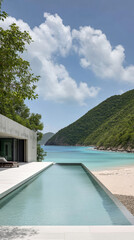 Fototapeta premium Luxury beachside villa with infinity pool overlooking turquoise water and lush mountains in a tropical paradise