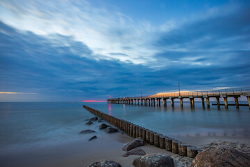 Fototapeta premium Pier in the evening after sunset in the Baltic Sea 