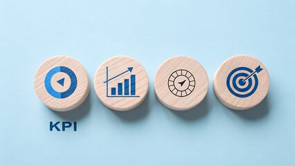 Wooden circles display kpi icons, representing performance metrics, target achievement, and business growth on a blue background, symbolizing key indicators