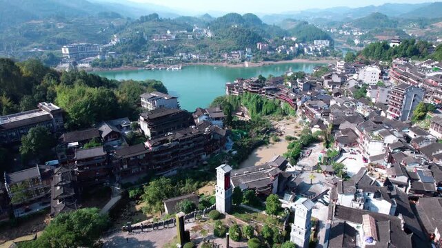 The ancient houses of Furong Town hanging on the cliff waterfall