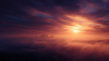 Obraz premium Dramatic sunrise illuminates a foggy city skyline with vibrant hues of orange and purple creating an atmospheric urban landscape