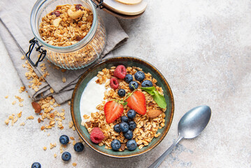 Healthy breakfast granola bowl with fresh berries