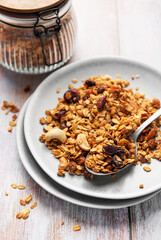 Healthy homemade granola mix on plate with spoon