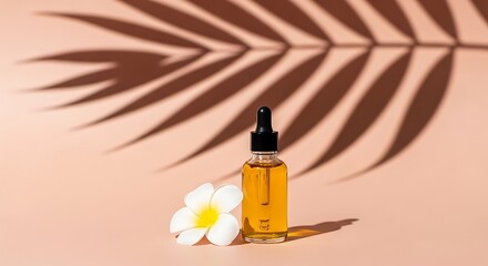 Golden Serum Bottle with Plumeria and Palm Shadow on Peach Background.