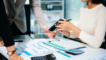 Business people meeting at office writing notes about sticky notes Laptop,tablet Planning and Brainstorming Strategies of Colleagues in office.
