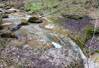 River canyon in spring on a sunny day, walking along the riverbank