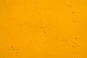 Yellow Autumn background,Wall texture with rough plaster.floor concrete with grunge texture for art design project creative presentations.Abstract surface of yellow vivid color and artistic texture