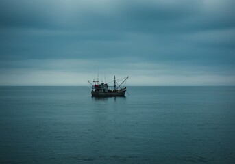Solitary fishing vessel navigates vast, moody ocean under dramatic, overcast sky evoking a sense of isolation and adventure