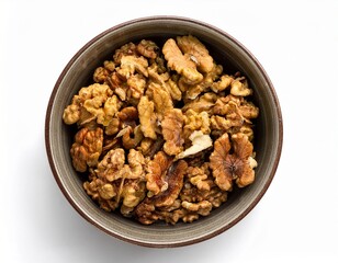 Obraz premium Bowl of Walnuts: A Close-Up of Shelled Walnuts in a Textured Bowl, Placed on a Clean White Surface for a Healthy Snack.