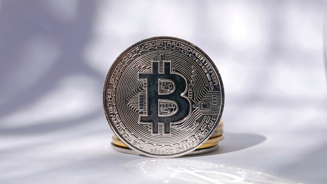 16:9 landscape photography, Silver coins on a white background, Investment ideas in bitcoin cryptocurrency concept

