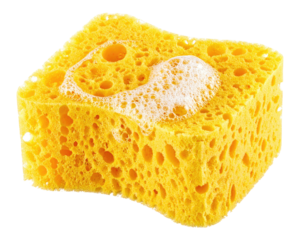 Close-up of a yellow, porous cleaning sponge with soap suds on a transparent background