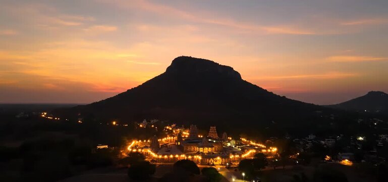 Karthigai deepam festival sacred mountain illuminated with dazzling lights at sunset a vibrant display of hindu devotion and culture