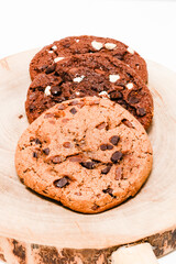 stuck of chocolate brownie cookies on wooden background. Homemade pastry.