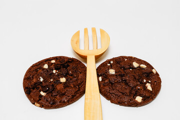 stuck of chocolate brownie cookies on wooden background. Homemade pastry.