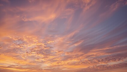 Obraz premium Dreamy pastel sky with golden clouds at sunset, perfect for inspirational backgrounds or peaceful designs, evoking serenity and wonder, an ethereal vista