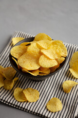Sour Cream and Onion Flavored Chips in a Bowl, side view.