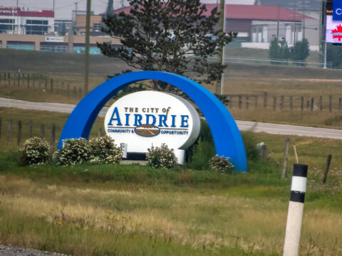 Airdrie , Alberta, Canada. Oct 14, 2025.The distinctive "The City of Airdrie" welcome sign, featuring a blue arch, representing community, opportunity, and urban identity.