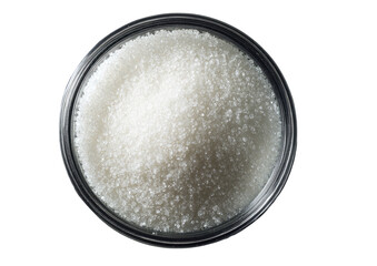 Bowlful of pure white sugar, top view on dark background