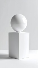 White sphere atop a white cube, minimalist studio shot