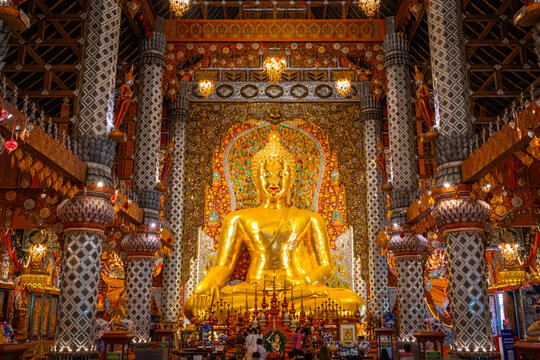 Chiang Mai, Thailand&mdash;October 14, 2025: The golden Buddha statue at Wat Si Don Mun glows with divine beauty and rich Lanna art, creating a peaceful and spiritual atmosphere inside the temple.