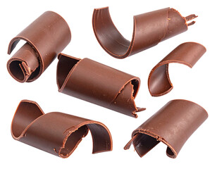 Scattered chocolate curls isolated on white background. Close-up of cocoa shavings for cake or ice cream decoration.