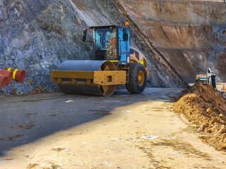Construction machinery working in open pit mine