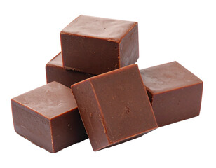 Group of chocolate fudge pieces isolated on white. Sweet, dense confectionery blocks for dessert or treat.