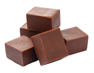 Group of chocolate fudge pieces isolated on white. Sweet, dense confectionery blocks for dessert or treat.