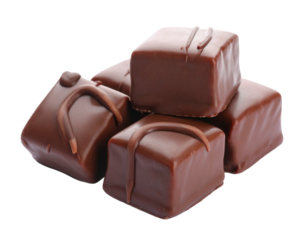 Group of chocolate fudge pieces isolated on white. Sweet, dense confectionery blocks for dessert or treat.
