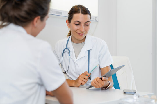Doctor consulting with patient in medical office during appointment