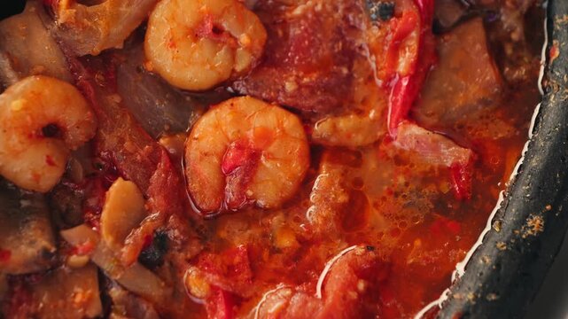Stewed shrimp with sweet and sour sauce with tomatoes and peppers. High quality 4k footage