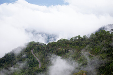 The road with mountain scenery with sea of ​​mist, clouds and forests offers amazing views of nature and travel.